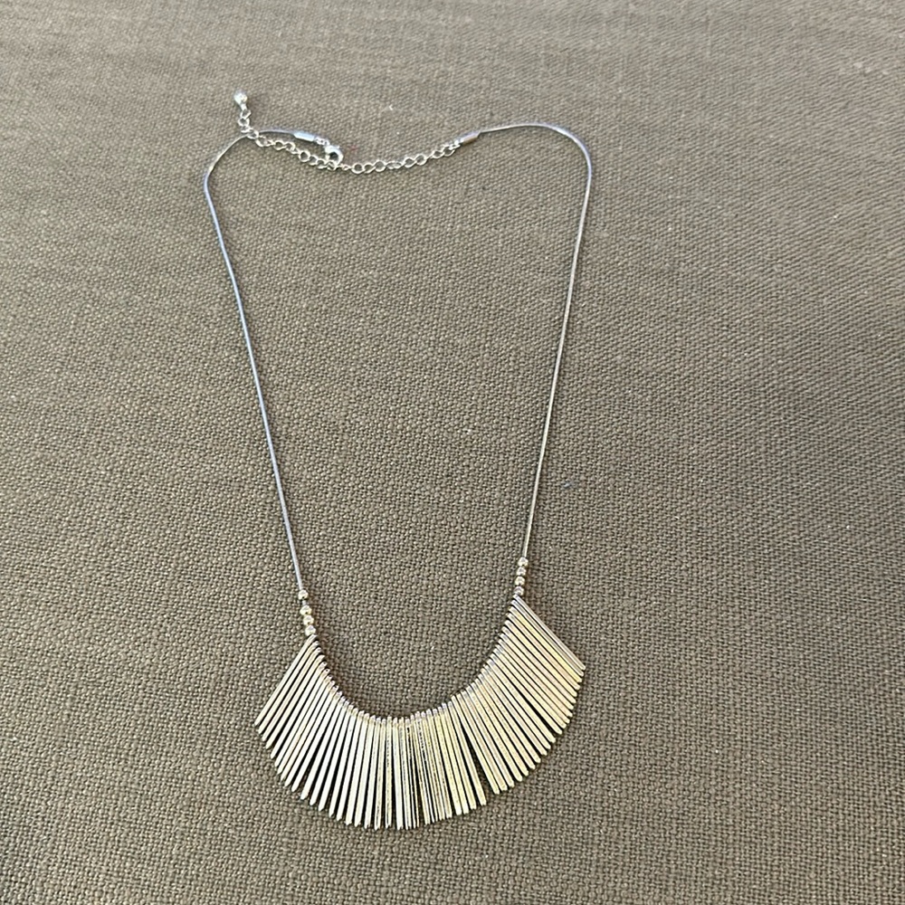 Gold colored necklace